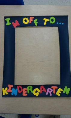 a wooden frame with the words i'm off to kindergarten on it