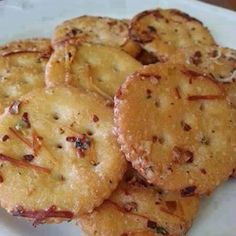 some crackers are sitting on a white plate