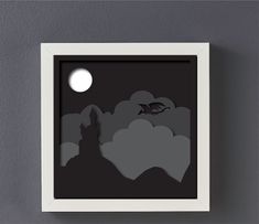 an image of a black and white night scene with the moon in the sky above clouds