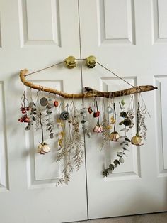 the door is decorated with various items hanging from it's hooks and strings,