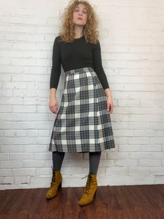 "Classic midi-length tartan kilt skirt. Muted blue dress Stewart, in cream, navy, forest green, olive, and brown. Covered-button side closure. Wide layered vent with fringe trim. No kilt pin. Pure virgin wool. by Bonda, Yarmouth N.S., Canada Excellent condition. Waist 28\" Hips 44\" Length 28 1/2\"" Mod Print, Kilt Skirt, Stewart Tartan, Tartan Kilt, Kilt Pin, Muted Blue, Green Olive, Fringe Trim, Wool Plaid