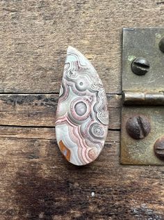 a doorknob with a marbled design on it next to some coffee beans