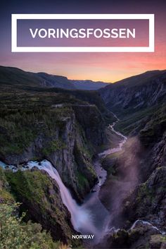 a river flowing through a valley surrounded by mountains