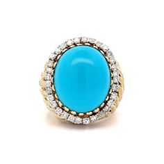 Vintage Turquoise & Diamond Cocktail Ring in Yellow Gold Make a statement with this stunning vintage cocktail ring! Crafted in 14 karat yellow gold, this Mid-Century piece features a richly textured band and an oval cabochon cut turquoise as the centerpiece. At 16.87 carats, the cabochon cut turquoise exudes a captivating blue hue, making it a standout in any crowd. Surrounding the turquoise are thirty-two (32) accenting natural diamonds, each measuring 1.8mm and weighing .025 carats, for a tota Elegant Collectible Cabochon Turquoise Ring, Luxury Yellow Gold Turquoise Ring For Formal Occasions, Elegant Collectible Turquoise Ring, Heirloom Yellow Gold Turquoise Ring For Formal Occasions, Elegant Turquoise Ring Collectible, Vintage Yellow Gold Turquoise Ring For Formal Occasions, Vintage Cocktail Ring, Diamond Cocktail Ring, Diamond Cocktail Rings