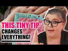 a woman is holding up her pants with the words, this tiny tip changes everything