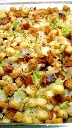 a casserole dish filled with stuffing and vegetables