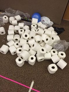 many rolls of toilet paper are on the floor