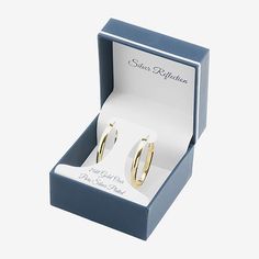 Add these Silver Reflections 24K gold over brass hoop earrings to your jewelry collection today! These hoop earrings are featured in 24K gold over brass, a sleek oval design, 40mm in length and have hinged closure. With the simple and sleek design of these hoops, they can be worn with any wardrobe choice. By adding these to your jewelry collection, you will be adding a staple piece. Earrings are boxed for gift giving! Wipe these hoop earrings clean with a soft cloth.Features: In A Gift Box, Nic… Tarnish Resistant Gold Hoop Earrings For Gift, Gold Tarnish Resistant Hoop Earrings As Gift, Classic Gold Hoop Earrings Nickel Free, Classic Gold Hoop Earrings With Lever Back, Gold Hallmarked Huggie Earrings For Gifts, Hallmarked Gold Huggie Earrings For Gift, Hallmarked Hoop Huggie Earrings For Gift, Gift Hallmarked Hoop Huggie Earrings, Gold Sterling Silver Hoop Earrings For Gift