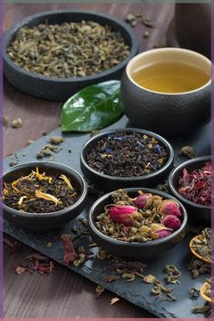 four bowls filled with different types of tea