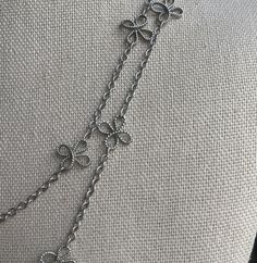 This is a darling, delicate chain with flowers. It is silver tone and can be doubled for another look. It does have an adjustable chain, and it is circa early 2000's Silver Necklaces With Flower Charm For Spring, Delicate Adjustable Silver Flower Necklace, Silver Necklace With Flower Charm For Spring, Elegant Adjustable Flower Necklace With Delicate Chain, Elegant Silver Metal Flower Necklace, Dainty Silver Flower Necklace With Delicate Chain, Elegant Metal Flower Necklace With Adjustable Chain, Silver Flower Pendant Necklace With Adjustable Chain, Cameo Brooch