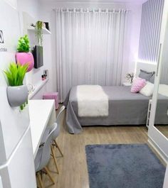 a bedroom with a bed and desk in it