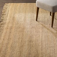 an area rug with a chair in the background