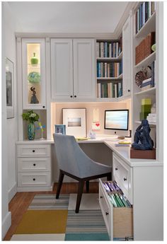 a home office with built - in bookshelves, desk and chair is shown