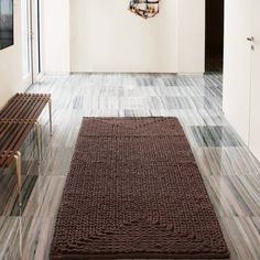 a brown rug on the floor in a room