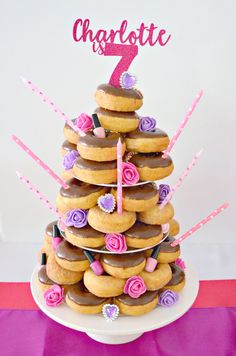 a cake made to look like a tower of doughnuts