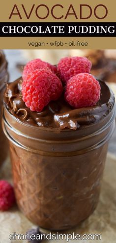 chocolate pudding in a jar with raspberries on top and the title above it