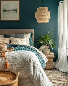 a bedroom with teal walls and wicker baskets hanging from the ceiling, along with a bed