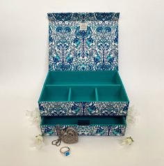 a blue and white box with keys in it