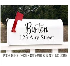 a white mailbox with the words burton 123 any street on it and a red post