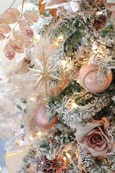 a decorated christmas tree with pink and gold ornaments