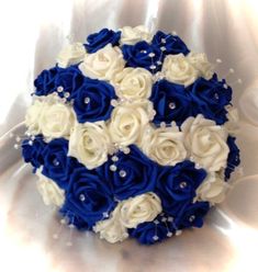 a bridal bouquet with white and blue flowers