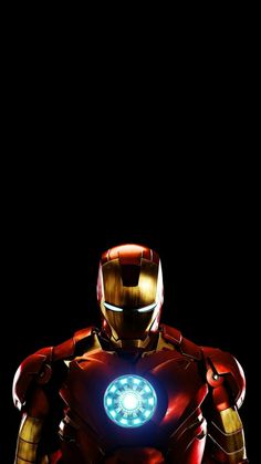 the iron man is standing in front of a black background