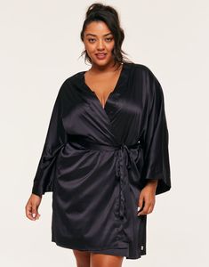 This black kimono robe is made from recycled polyester and has a soft satin fabrication. It comes with a self-tie closure and has a relaxed fit. It's perfect for a cozy night. (Available in plus-sizes 1X-4X.) Black Satin Sleepwear For Loungewear, Black Satin Sleepwear For Lounging, Satin Open Front Loungewear Robe, Open Front Satin Robe For Loungewear, Black Satin Sleepwear, Black Satin Long Sleeve Sleepwear, Satin Wrap Kimono For Loungewear, Black Open Front Robe For Loungewear, Black Long Sleeve Sleep Robe