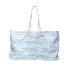 a blue and white striped bag on a white background