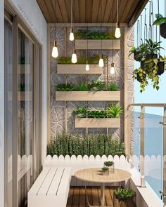 a balcony with potted plants on the wall and wooden table in front of it