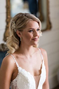 a woman in a wedding dress looking at the camera