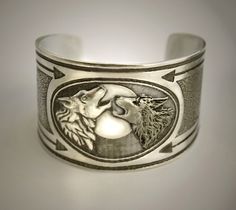 Feed the Good wolf cuff bracelet. $28.99, via Etsy. Symbolic Silver Wolf Design Jewelry, Silver Wolf Design Symbolic Jewelry, Silver Symbolic Wolf Design Jewelry, Silver Symbolic Metal Cuff Bracelet, Silver Stamped Cuff Bracelet For Friendship, Wolf Bracelet, Wolf Spirit, Wolf Head, Black Wolf