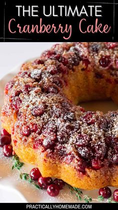 the ultimate cranberry cake is on a white plate