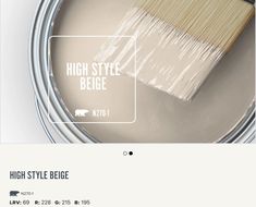 a paint can with a brush in it and the words high style beige on top