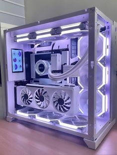 the inside of a computer case that is lit up with purple lights and fan blades