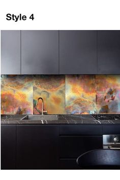 a kitchen with black cabinets and marble backsplashes that feature colorful swirls