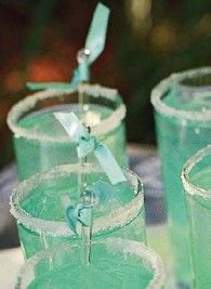 two green glasses sitting next to each other on top of a white table with the words pin it