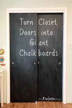 two black doors with chalk writing on them that say turn closet doors into giant chalkboards