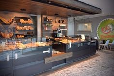 the inside of a bakery with many pastries on display