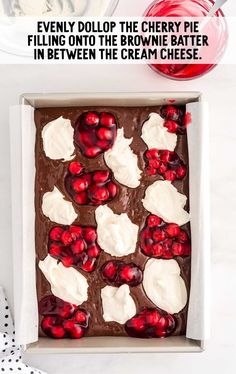 a chocolate dessert with cherries and whipped cream