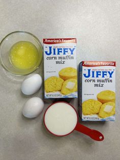 eggs, corn muffins and yogurt are sitting on the counter top