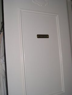 a white door with a sign on it