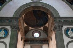 the inside of an old church with paintings on the walls