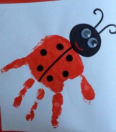 a child's handprint with a ladybug on it