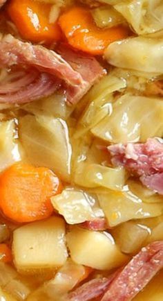 some meat and vegetables are being cooked together