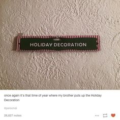 a sign that says holiday decoration on the wall