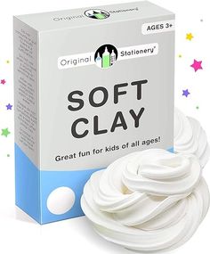 a box of soft clay next to a white ball