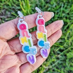 Rainbow Pastel Anxiety earrings. Each earring features the word "anxiety" displayed vertically. Each of the seven letters is a different color displayed on top of a white background. Order with the Default Stud to get the earring as pictured. If you would prefer an ear wire or hook, choose the Ear Hook option.Each earring measures 3 inches (7.6 cm). Metal is quality hypoallergenic stainless steel for sensitive ears. Materials: Acrylic Hypoallergenic Stainless Steel Note: The backs of these earri Colorful Piercings, Jewelry Text, Lesbian Earrings, Stainless Steel Mirror, Weird Jewelry, Steel Mirror, Rainbow Pastel, Funky Earrings, Mirror Acrylic