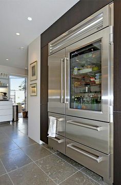 a large stainless steel refrigerator in a kitchen