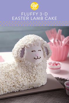 a cake shaped like a sheep sitting on top of a table