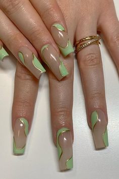 Experience the epitome of sophistication with these stunning Sage Green Swirly French Tips adorned with delicate Gold Accents. Click through to see the full collection and immerse yourself in the world of chic and elegant coffin nail designs. // Photo Credit: Instagram @nailsbykirstenchanel Green And Gold Nails Coffin, Green Nail Tip Designs, Green Nails Ideas Coffin, Sage Green And Gold Nails Acrylic, Sage And Blush Nails, Nail Inspo Green French Tip, Simple Acrylic Nails Green, Green Gel X Nail Designs, Green And Nude Nail Designs